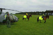 Military helicopter and riders in Hi-Viz