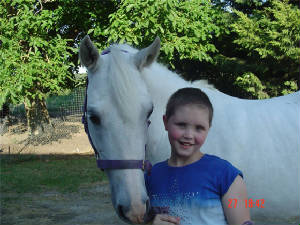 Kelly-Ann and her pony two months after surgey