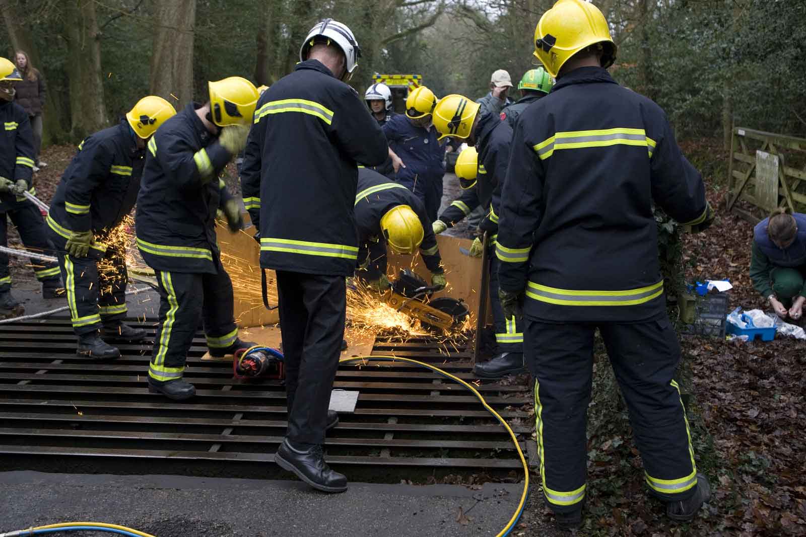 Fire-fighters using cutters on the cattle grid